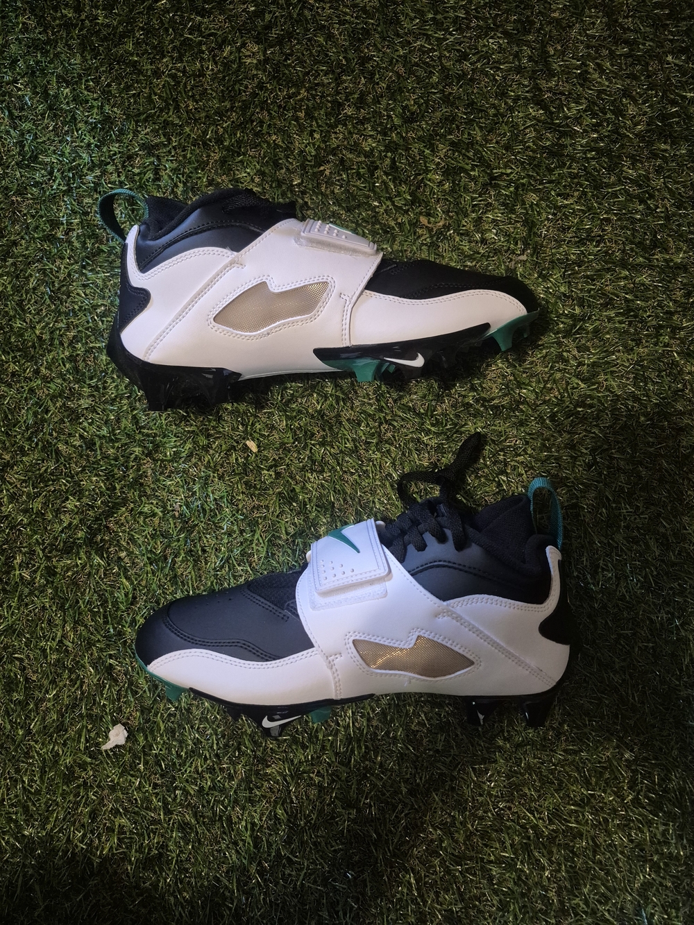 Kids White and Black Athletic Cleats with Teal Accents